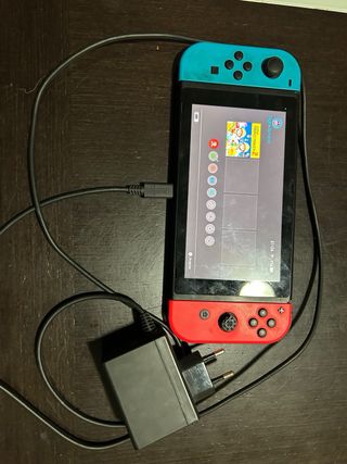 Nintendo Switch + Mando Pro Transparente + 2 Juego