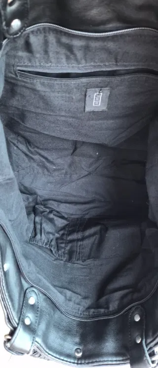 Bolso negro tejido con asas trenzadas