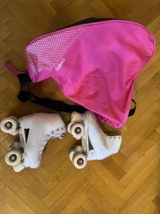 Patines 4 ruedas talla 32 + Bolso rosa