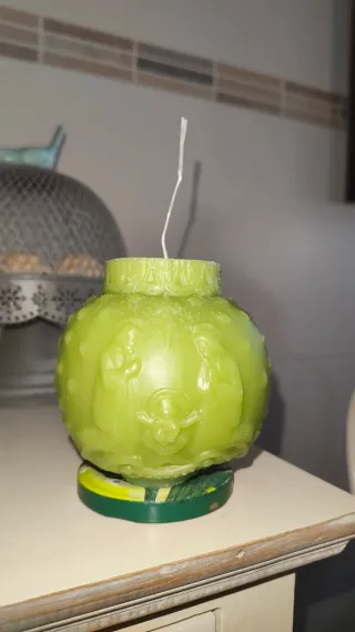 Vela verde con escena de Navidad