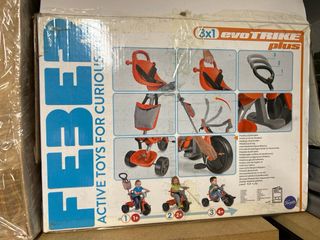 Triciclo infantil rojo y gris