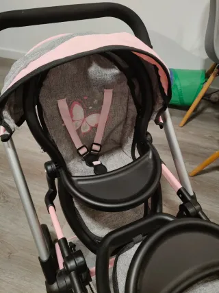 Carro gemelar de juguete gris y rosa