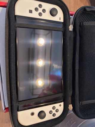 Nintendo Switch OLED + 5juegos + mando extra+funda