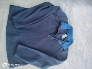 Polar azul con cremallera quechua talla 8-9 años