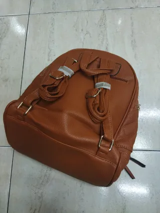 Mochila acolchada marrón con defecto