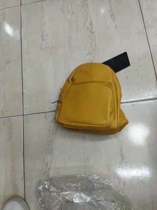 Mochila acolchada marrón con defecto