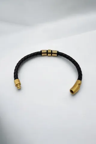 Pulsera trenzada hombre con detalles dorados