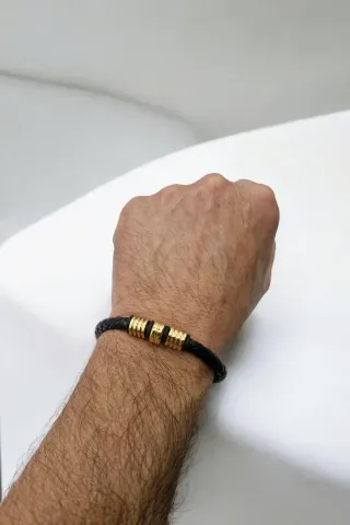 Pulsera trenzada hombre con detalles dorados