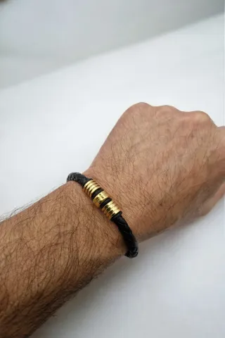 Pulsera trenzada hombre con detalles dorados