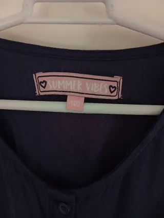 Mono verano azul con volantes rosa