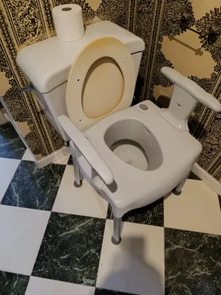 Asiento elevador WC
