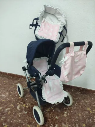 Carro de muñecas azul y rosa