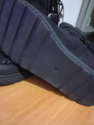 Stivaletti neri con frange