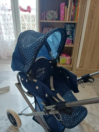 Carrito de muñecas azul con estrellas