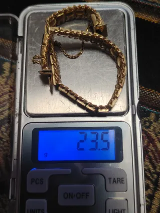 Pulsera- Esclava en  oro 18k con cadena de segurid