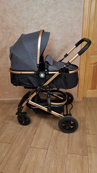 Carro de bebé gris y dorado