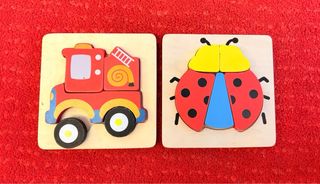 Lote de juguetes Fisher-Price y puzzles de madera.