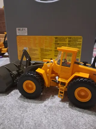 Pale yellow Volvo wheel loader toy