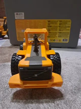 Pale yellow Volvo wheel loader toy