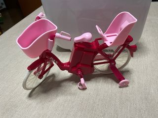 Muñecas con bici rosa