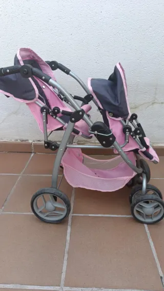 Carrito gemelar para muñecas rosa y gris