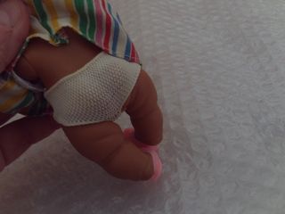 muñeca barriguitas negro, nuca pone 97, vestido or