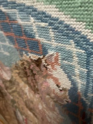 Cuadro de gato en sillón tejido