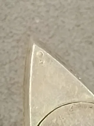 Figura de plata con forma de caracol