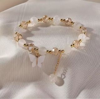 Pulsera elástica mariposa morada y dorada