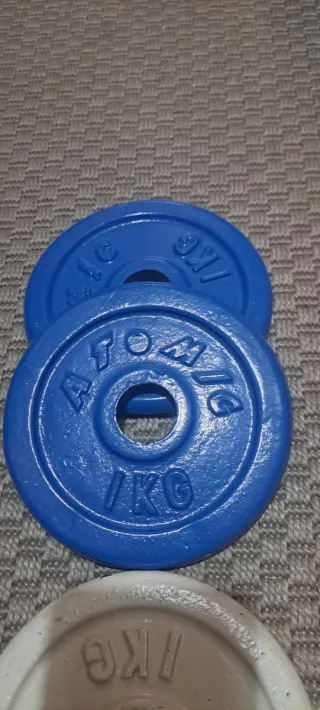 Lote 8 discos pesas 1 kg