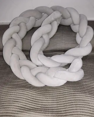 Cojín trenzado para bebé