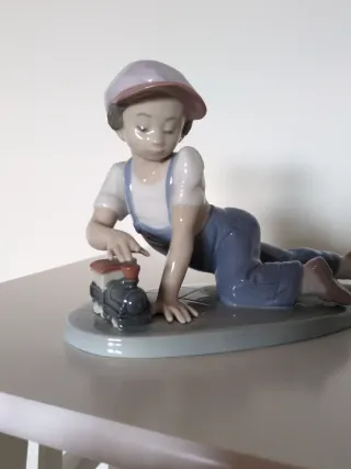 Escultura Lladro niño con cámara