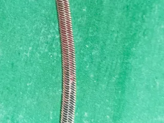 Pulsera tipo serpiente plateada