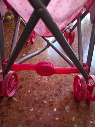 Silleta de muñeca rosa con lunares