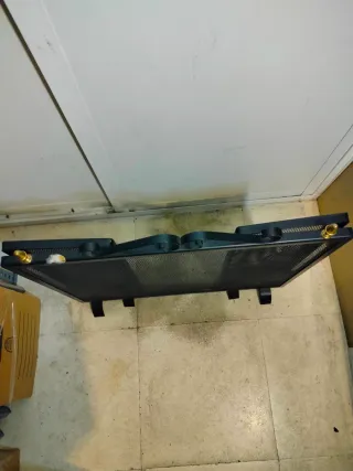 Rejilla chimenea metal negra y dorada