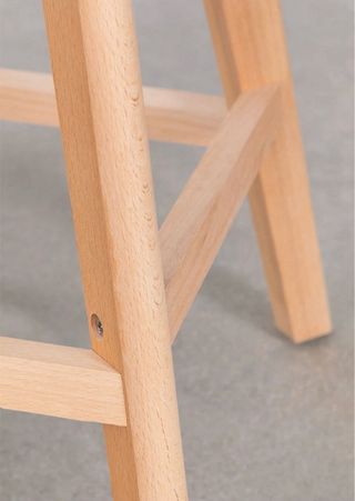 Taburete alto amarillo con cojín polipiel