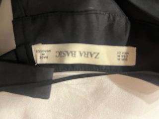 Camisa negra con detalle leopardo y lazo trasero