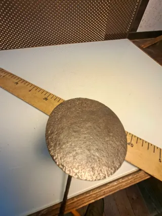 Quemador antiguo con mango de madera