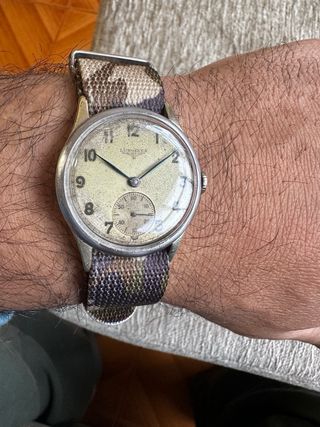 Reloj Longines esfera beige y correa camuflaje