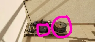 Banco de pesas con barra y discos