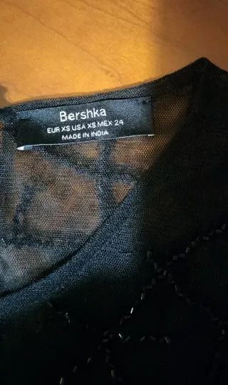 Top de fiesta transparente con paillets de Bershka