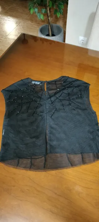 Top de fiesta transparente con paillets de Bershka