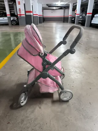 Cochecito de juguete rosa