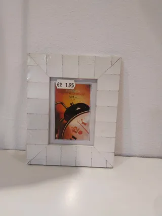 Marcos (2 nuevos) yportavelas de cristal.