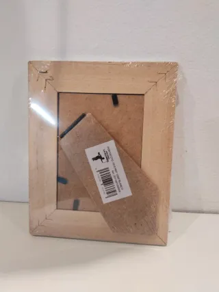 Marcos (2 nuevos) yportavelas de cristal.