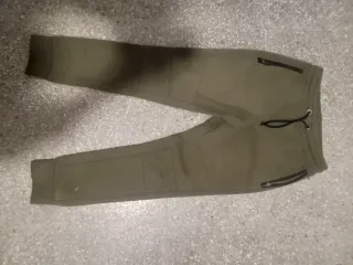 Pantalones de chándal verdes con cremallera