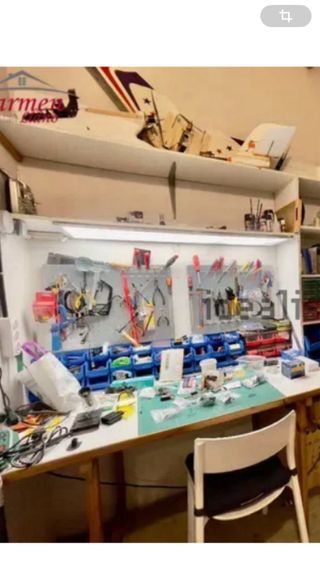 Panel perforado para herramientas y ganchos