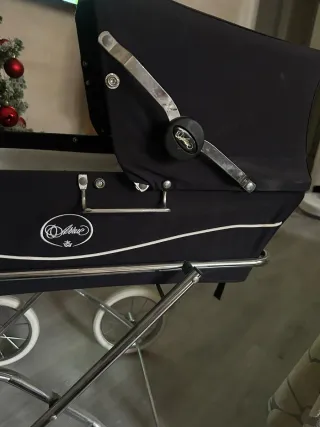 Carro de muñecas rosa con lunares