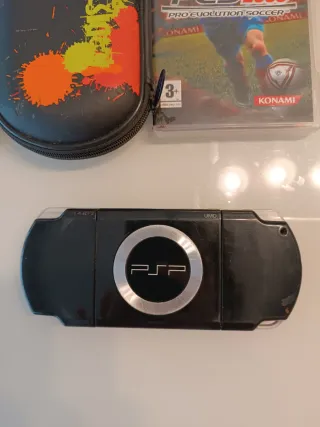 PSP Slim 2004 Nero + 5 giochi