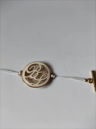 Pulsera Bimba y Lola dorada y blanca